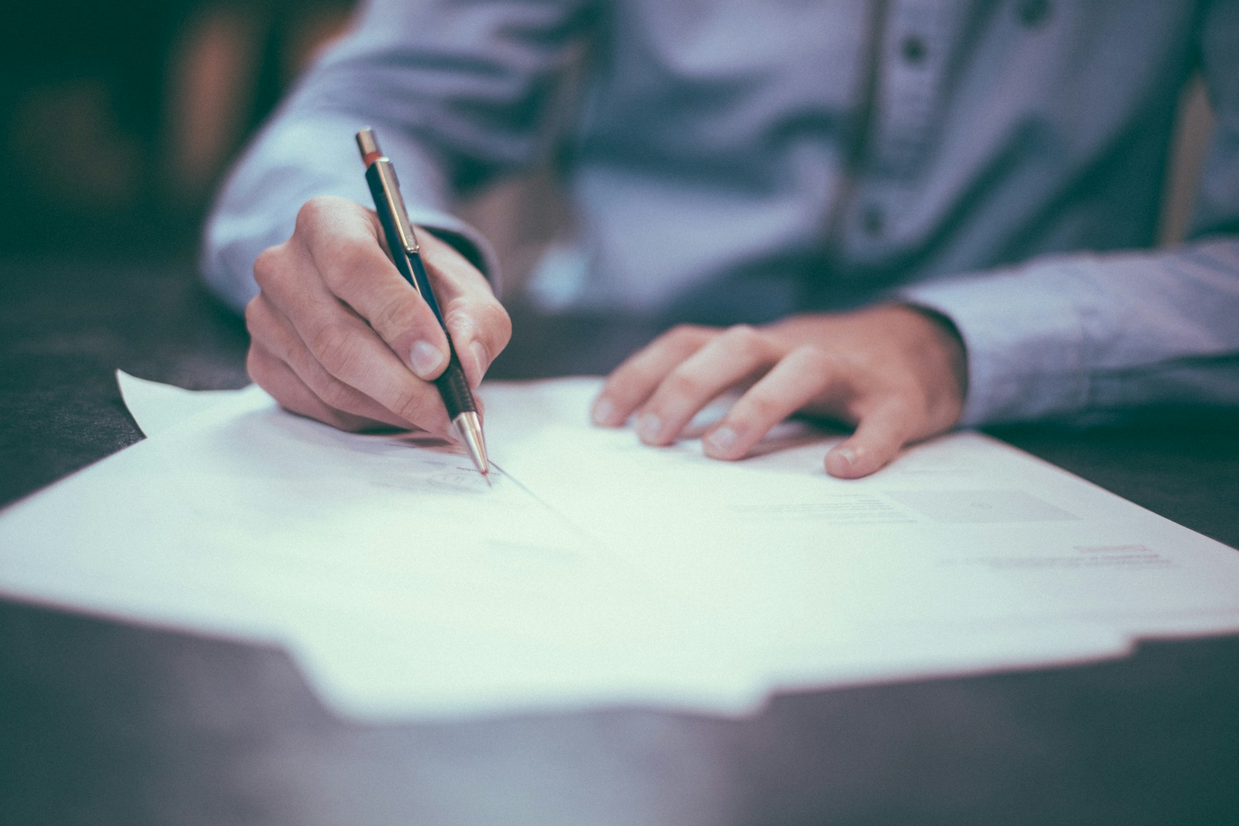 Person signing a business document